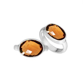 Handmade Sterling Silver ring with twin oval Citrine Quartz stones, polished Bali artisan design.